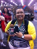 A woman poses with a Little Vampires plush toy