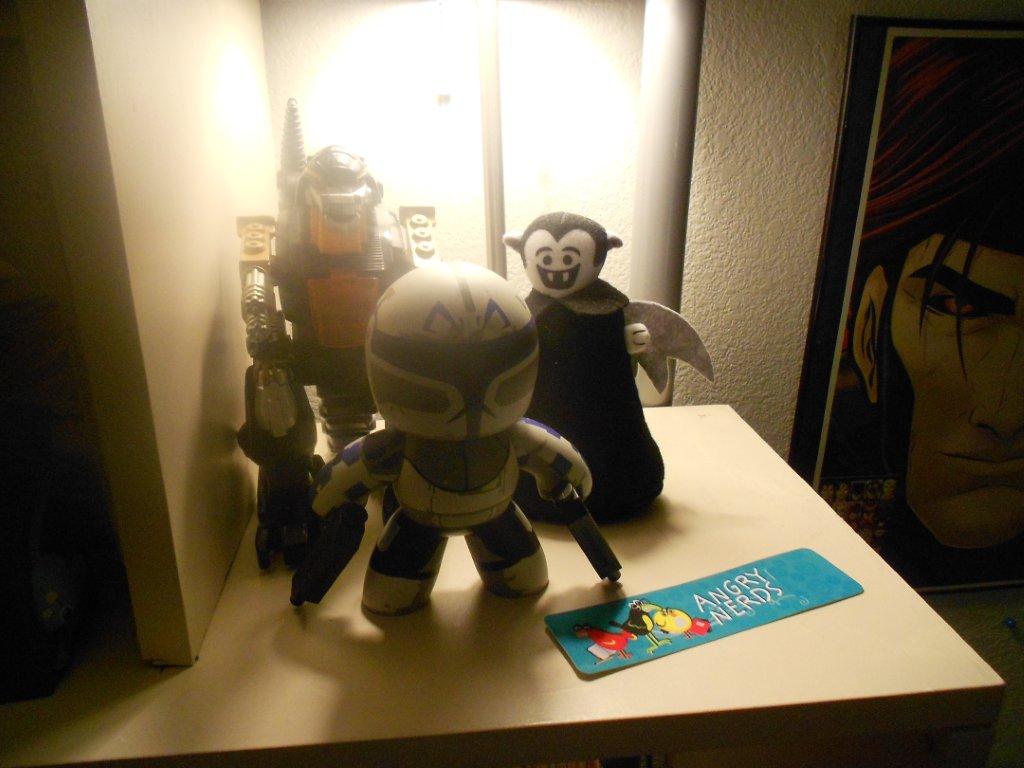 Photo by David Oakes of a Little Vampire plush toy posing with several other toys
