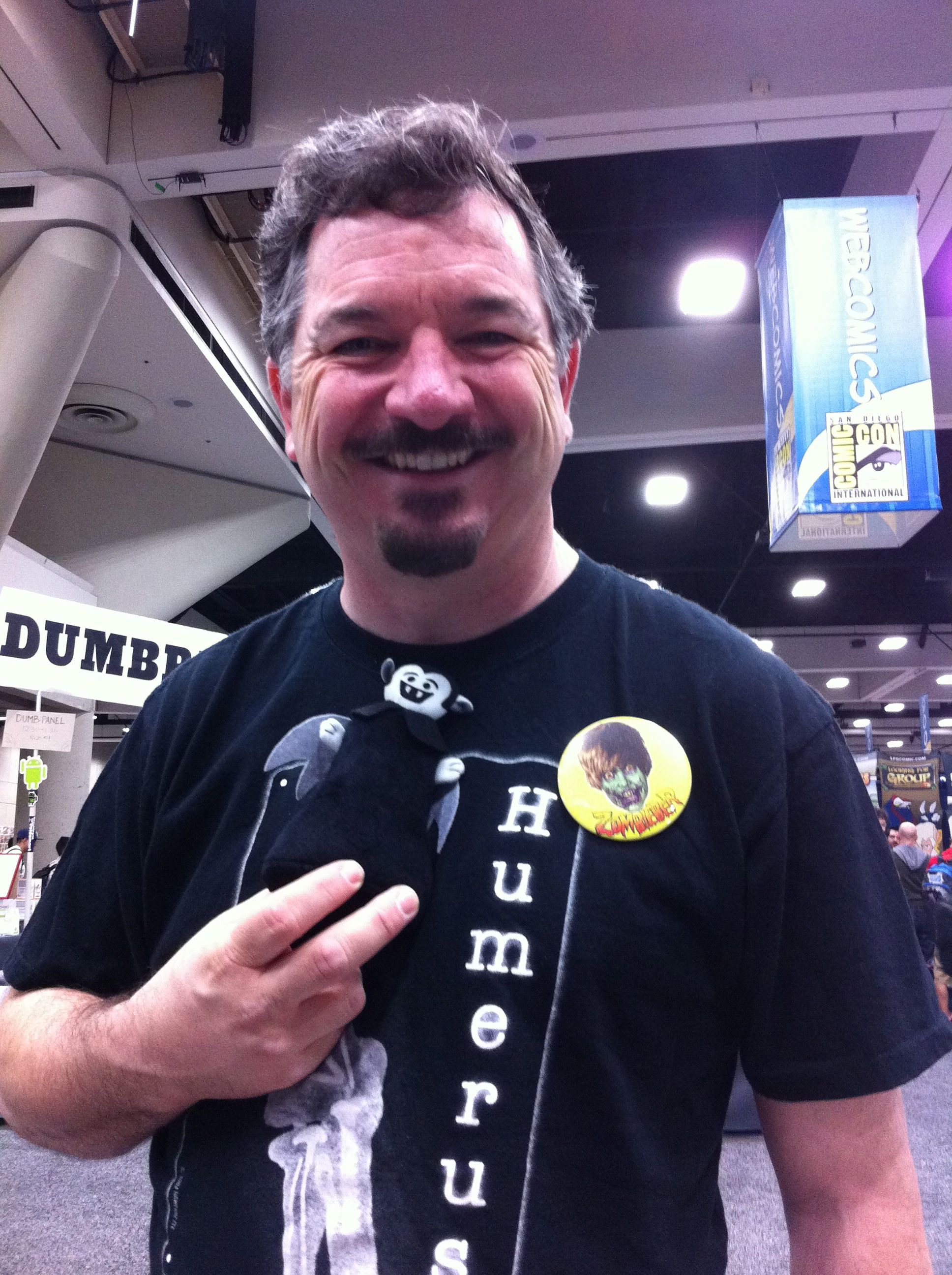 Photo of Brett from Humerus Online holding a Little Vampire plush toy