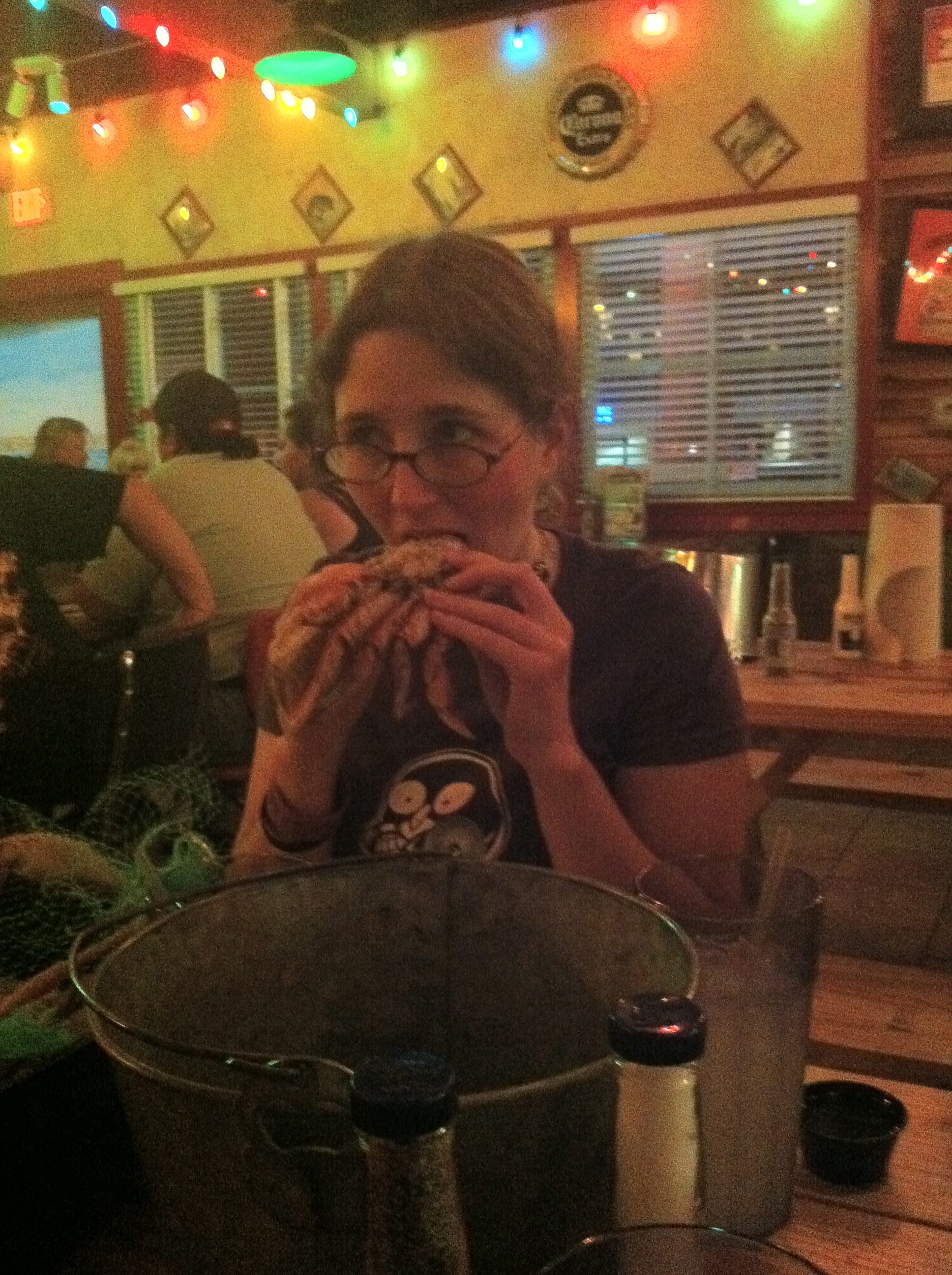 Photo of Jennie Breeden eating a crab at Joe’s Crab Shack after San Diego Comic-Con 201