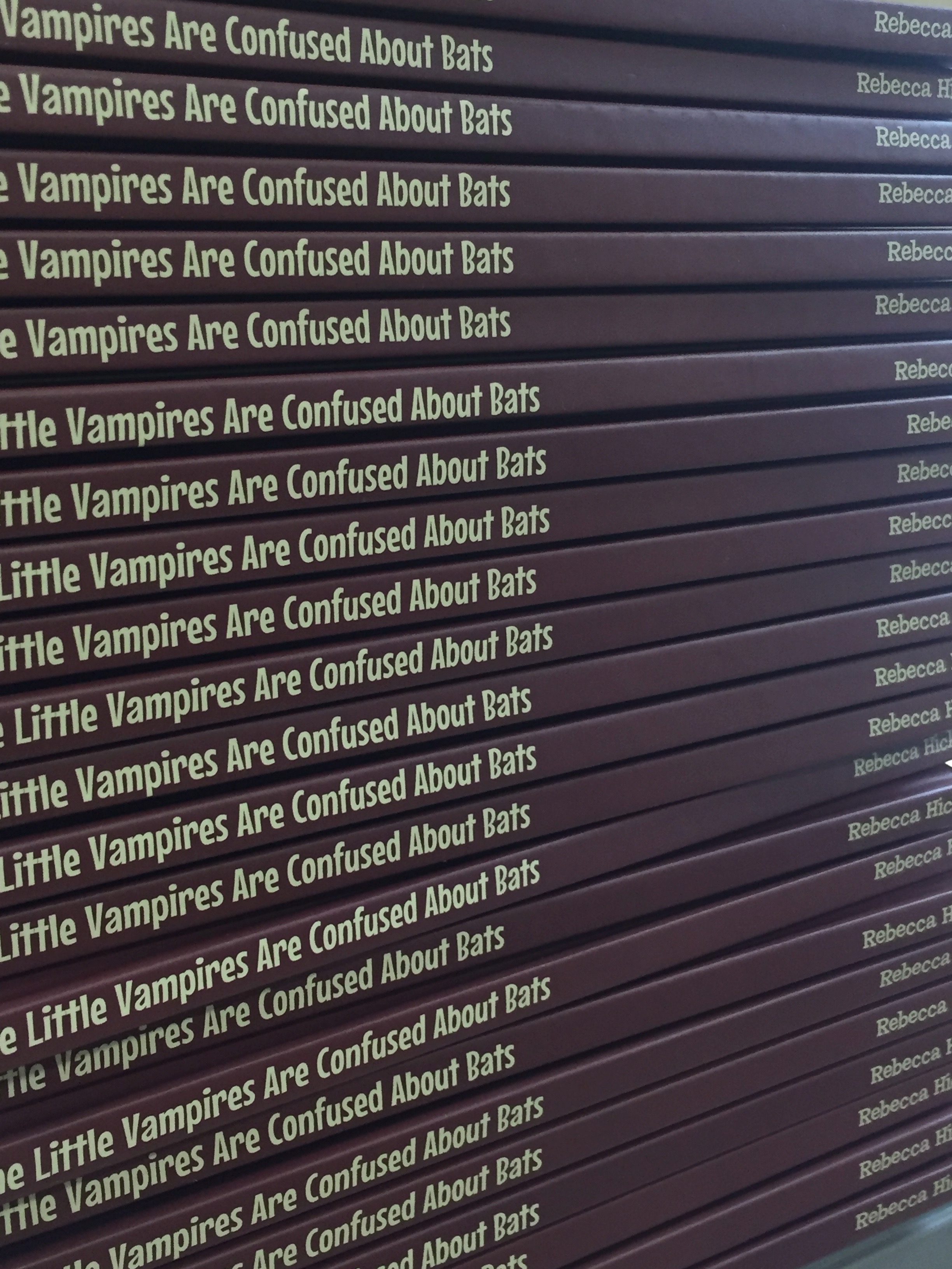 Photo of a stack of The Little Vampires Are Confused About Bats books