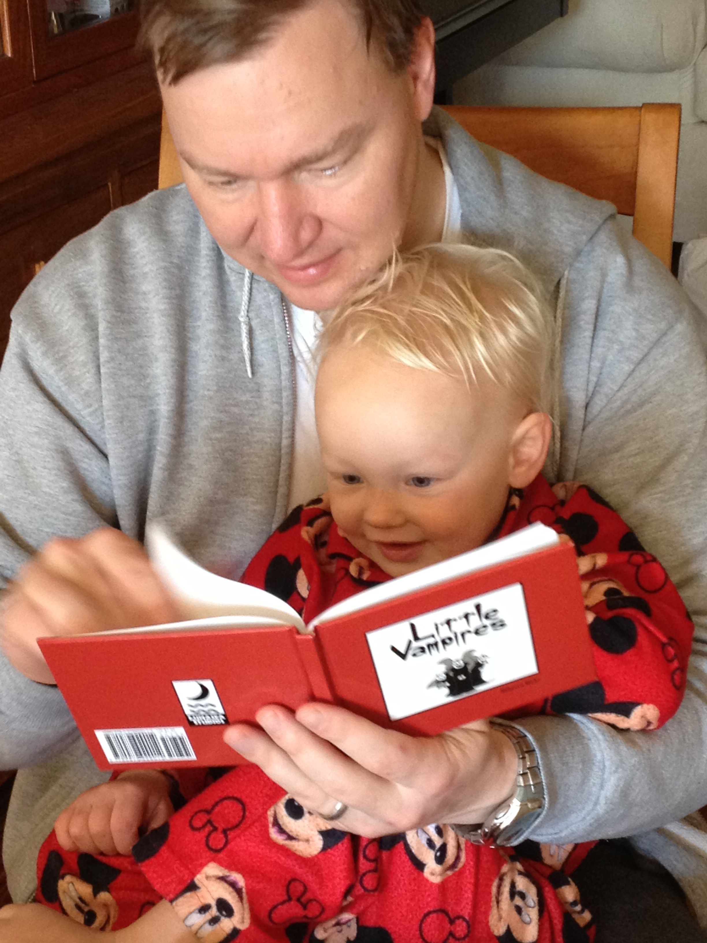 Photo of Peter and Austin Belding reading Little Vampires