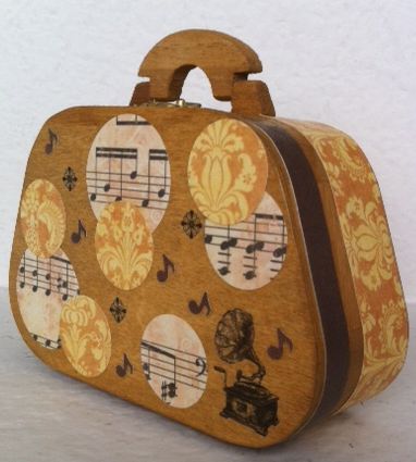 Photo of a wooden purse decorated with music imagery